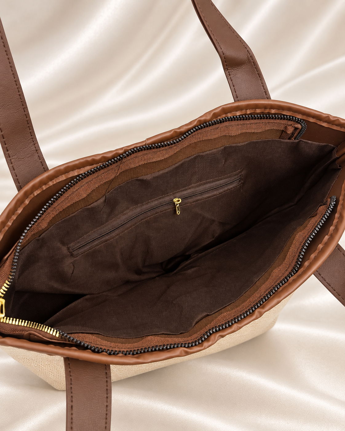Interior lining and zip pocket detail of beige and brown woven tote bag