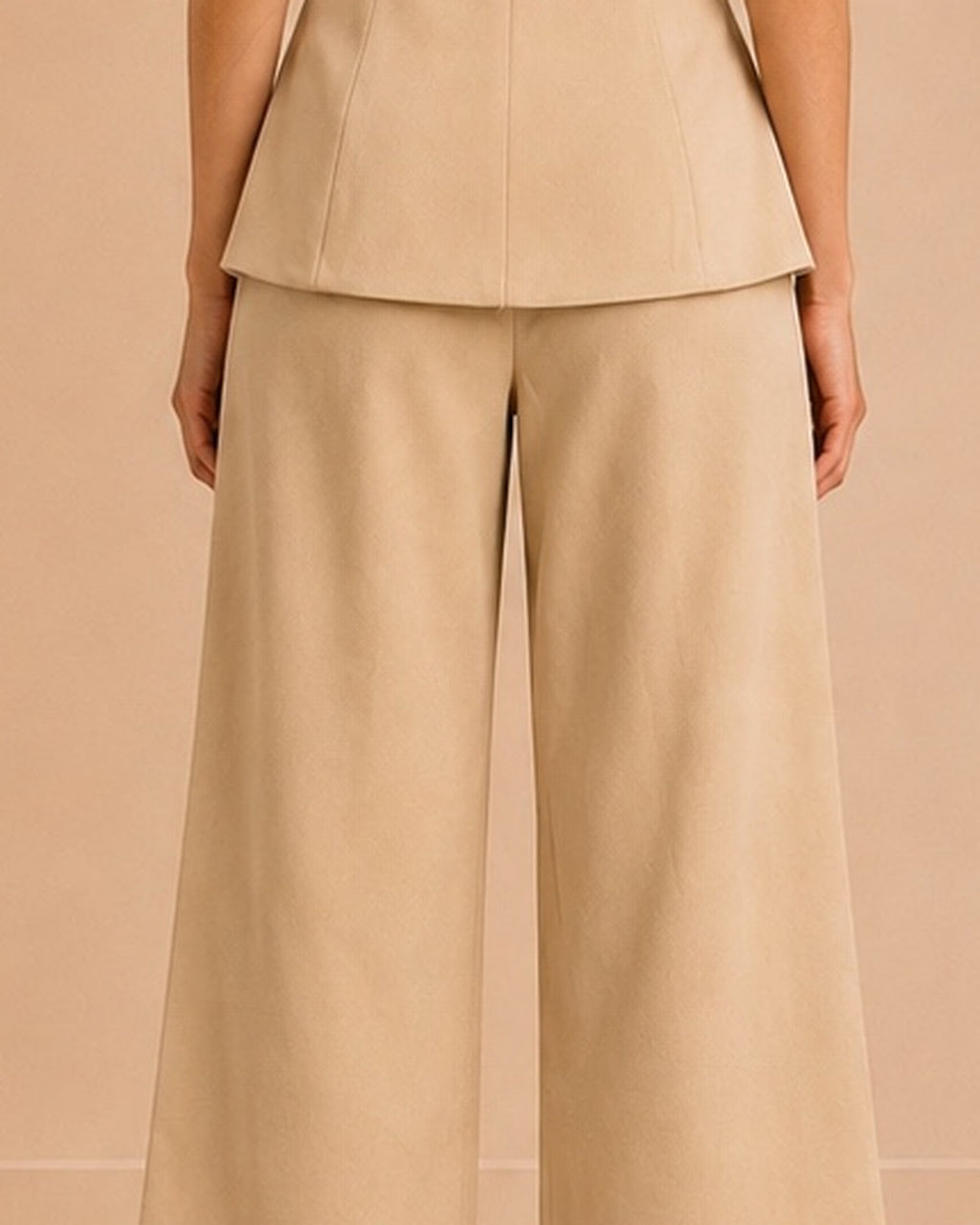 Beige tailored set back trouser upper center seam detail
