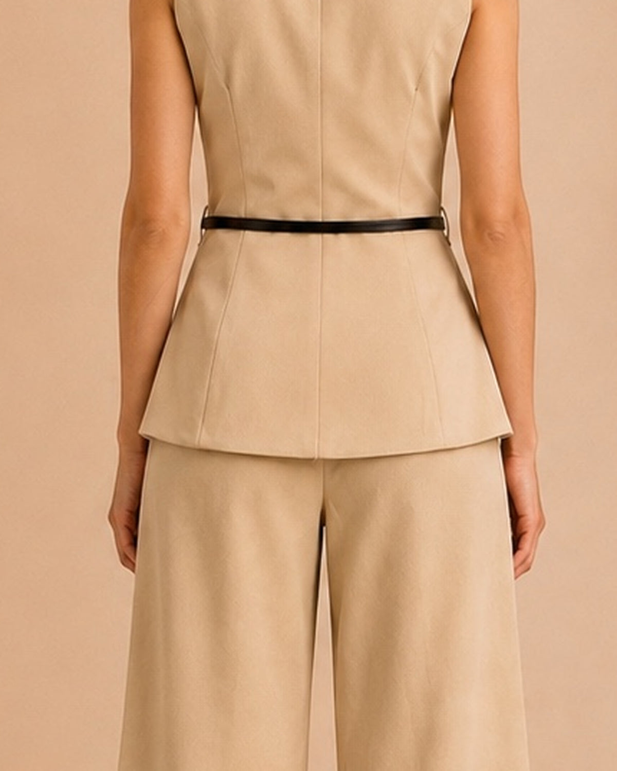 Beige tailored set back waist and peplum detail