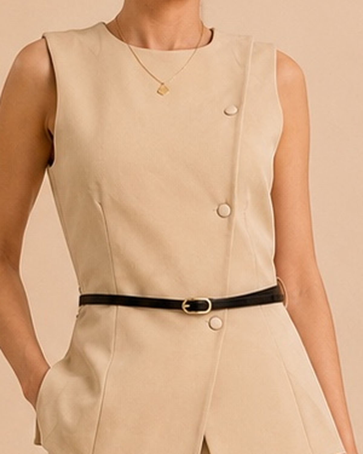 Beige tailored set covered buttons and asymmetrical front closure detail