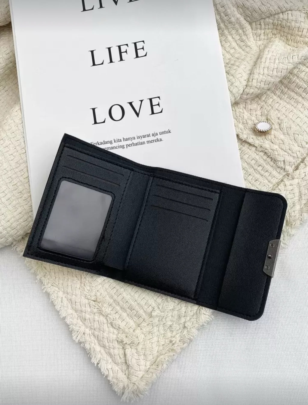 Black and beige compact wallet interior with card slots and ID window