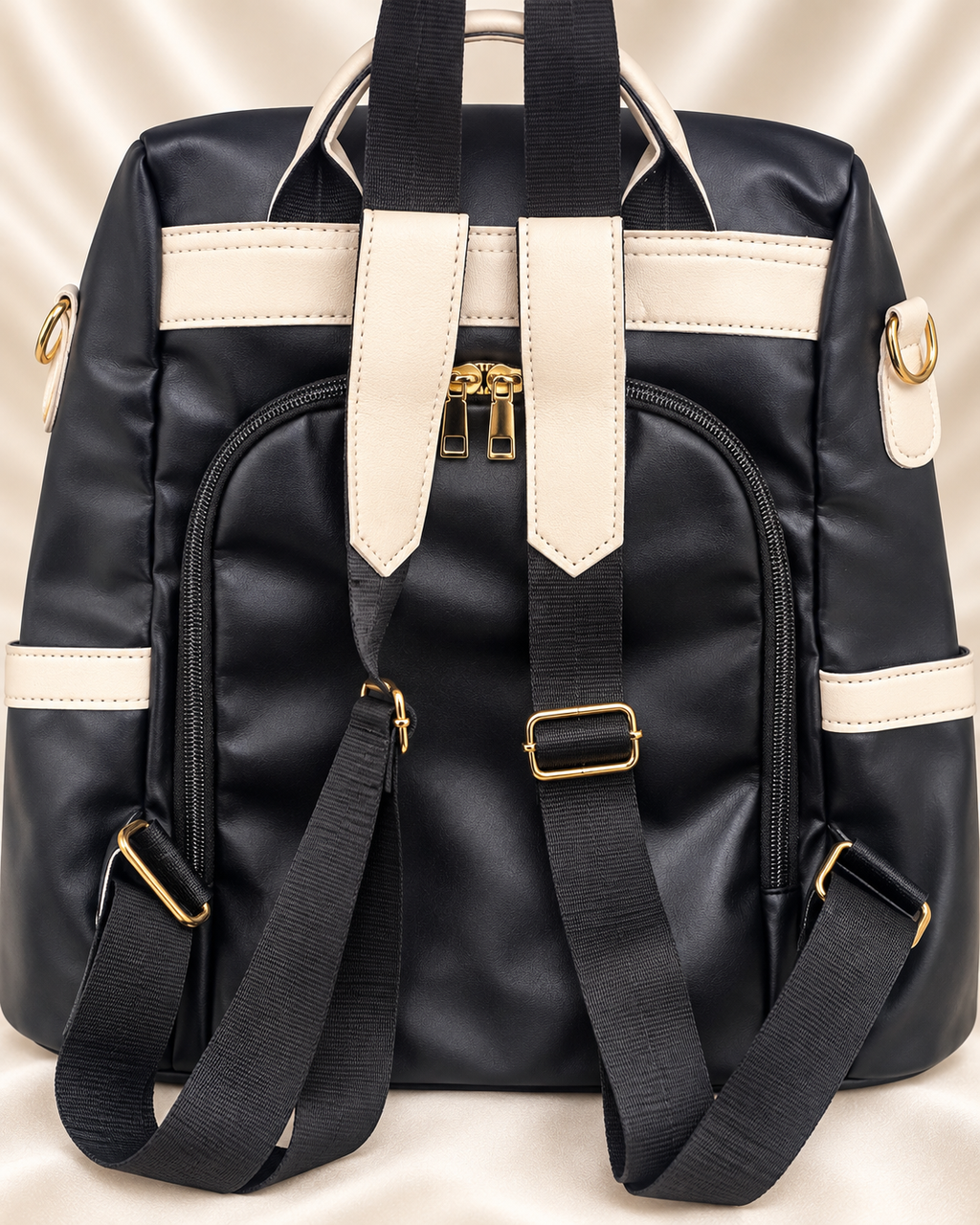 Black and cream convertible backpack back straps detail