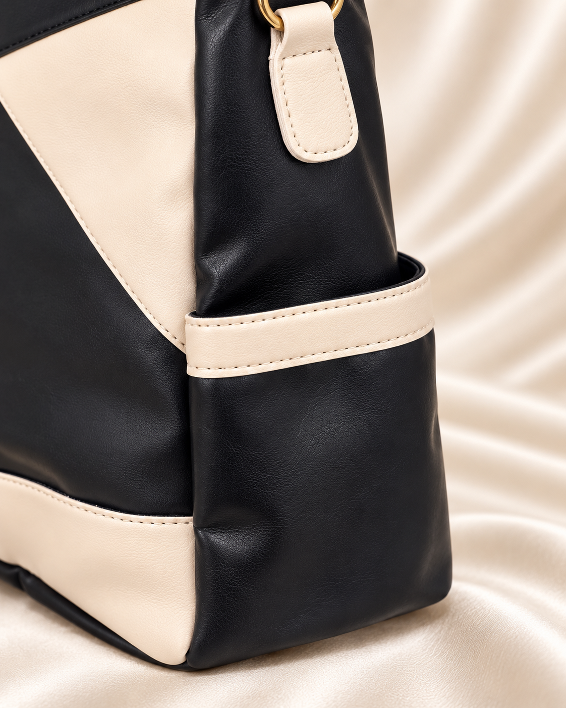 Black and cream bag side pocket detail