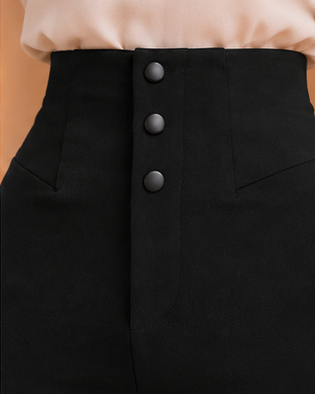Black high-waist trousers waistband and black button detail