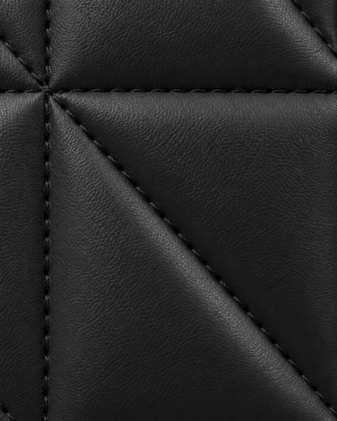 Black geometric handbag - leather texture and stitching close-up