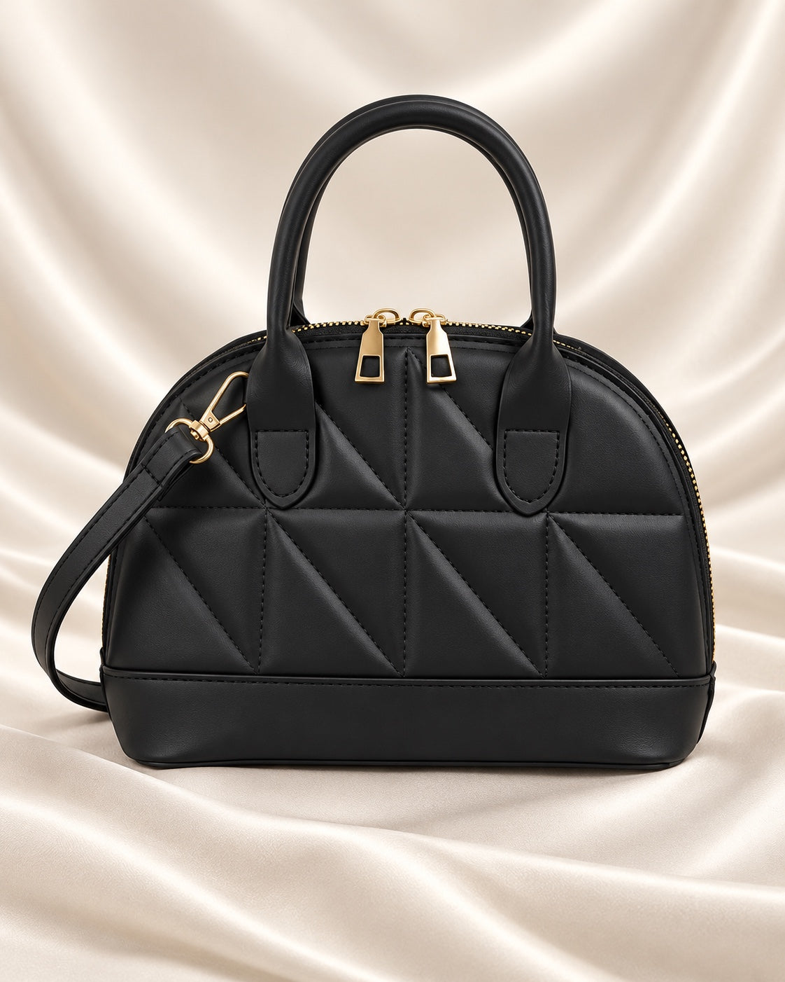 Black geometric quilted dome handbag - front view