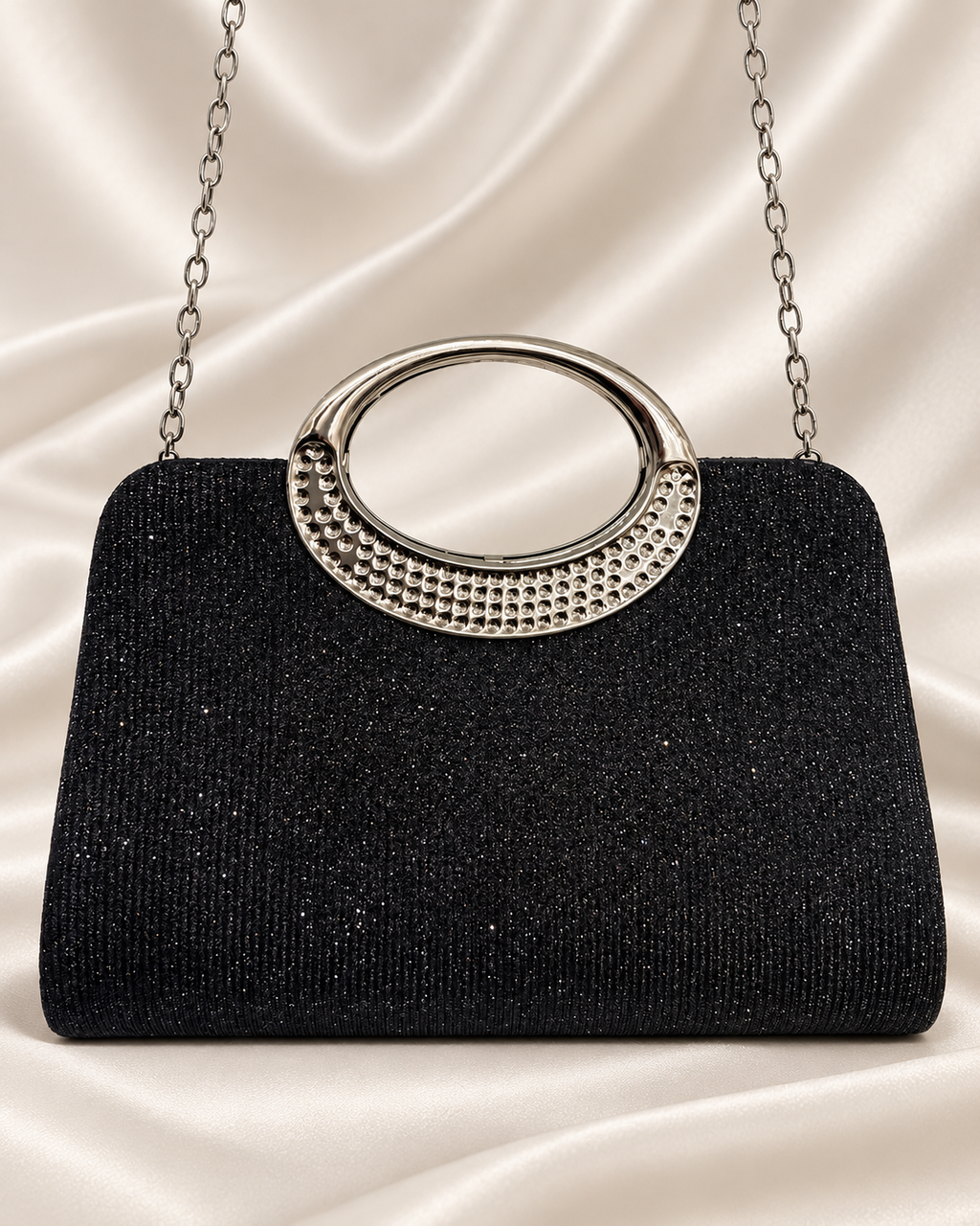 Black glitter evening bag with silver oval handle and chain