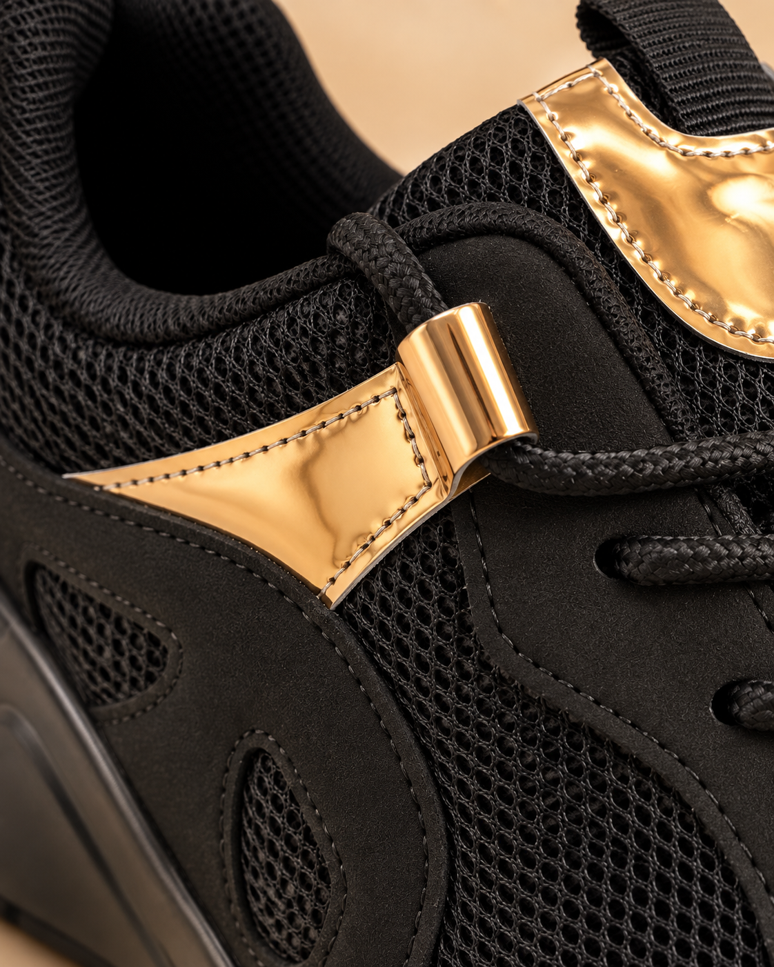 Black and gold sneakers - metallic gold accent detail