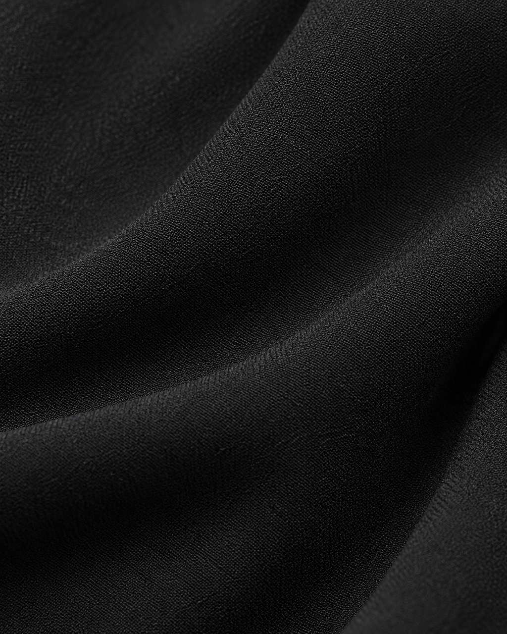 Black jumpsuit fabric texture detail