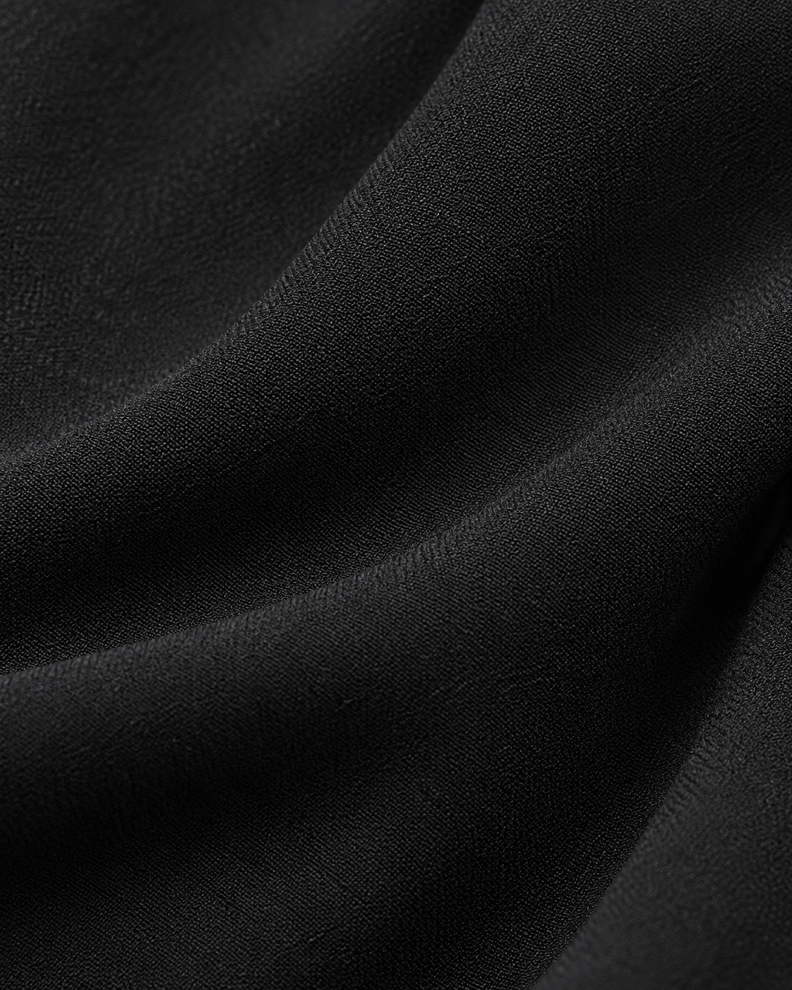 Black jumpsuit fabric texture detail
