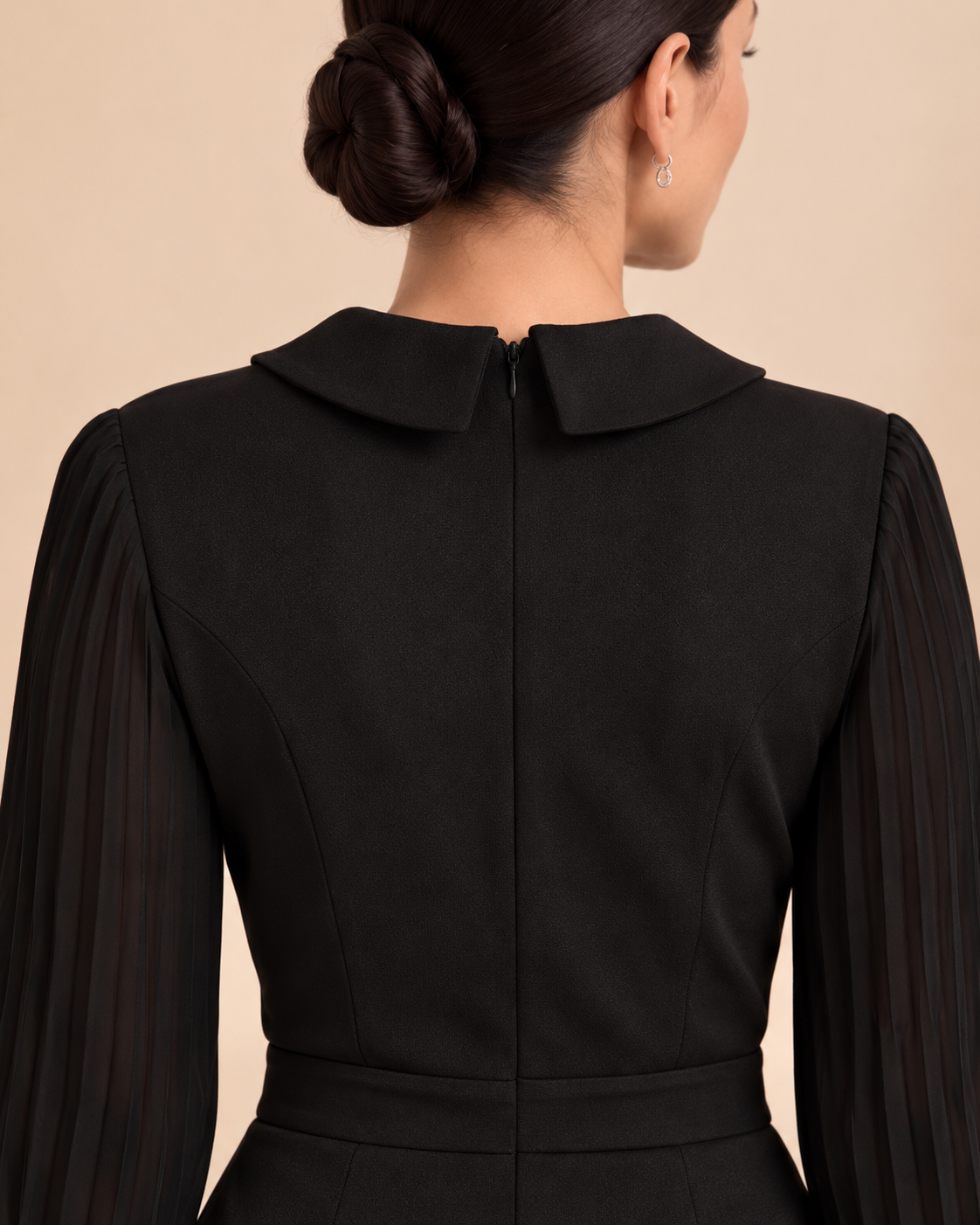 Black jumpsuit back neckline and zipper detail