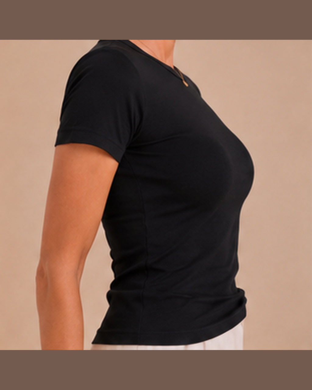 Black T-shirt side seam and fit detail