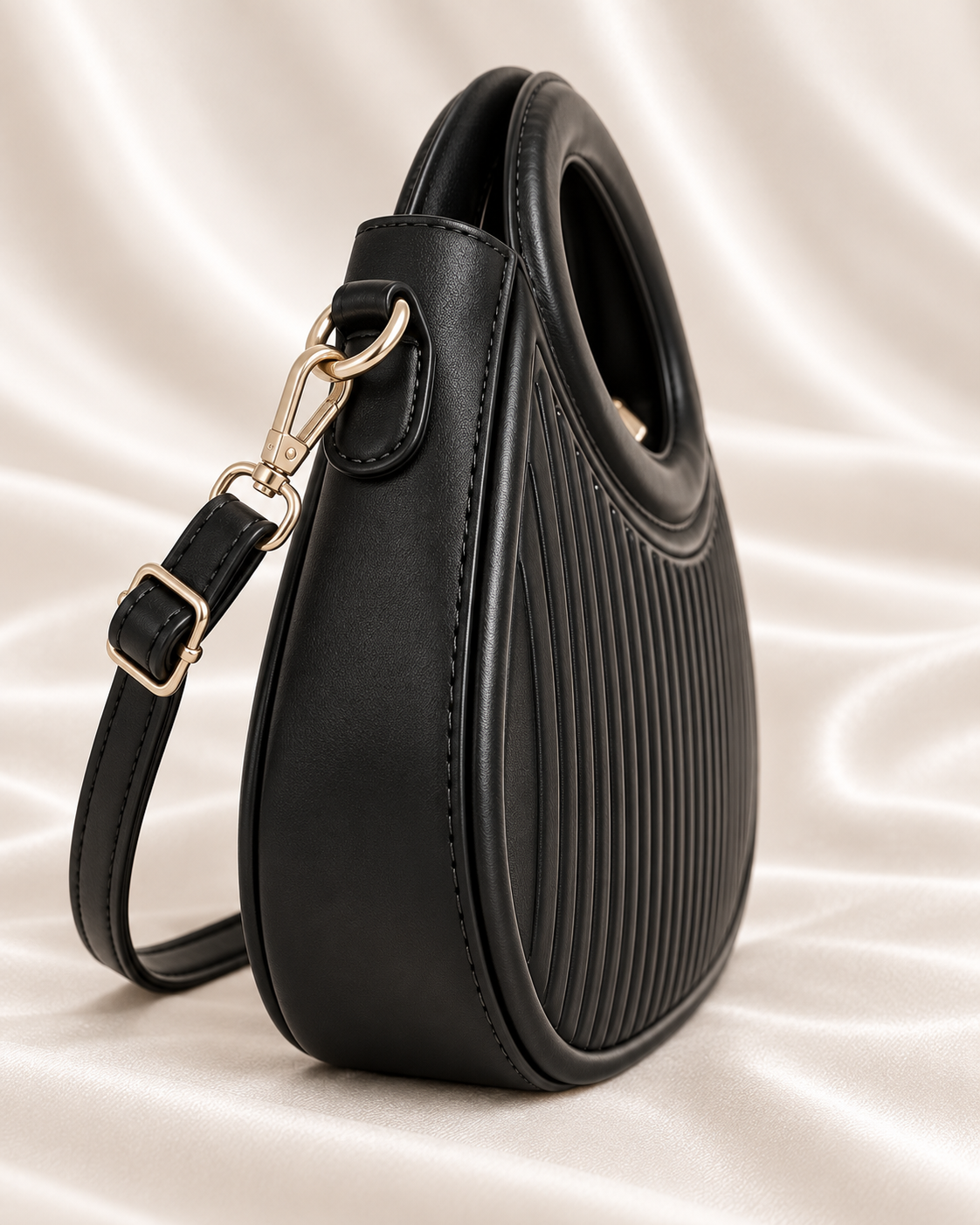 Structured black handbag side profile detail