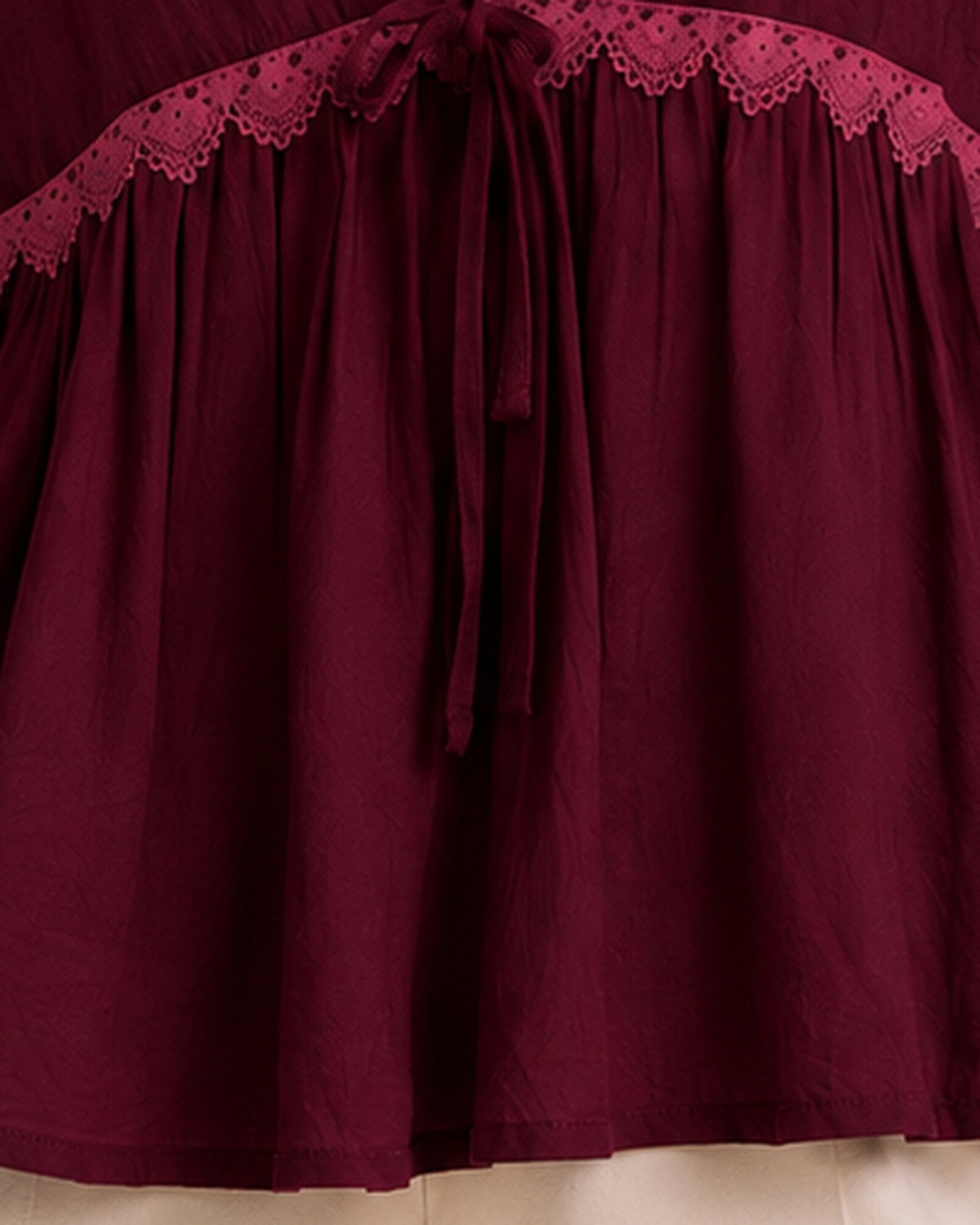 Burgundy blouse fabric texture and drape detail