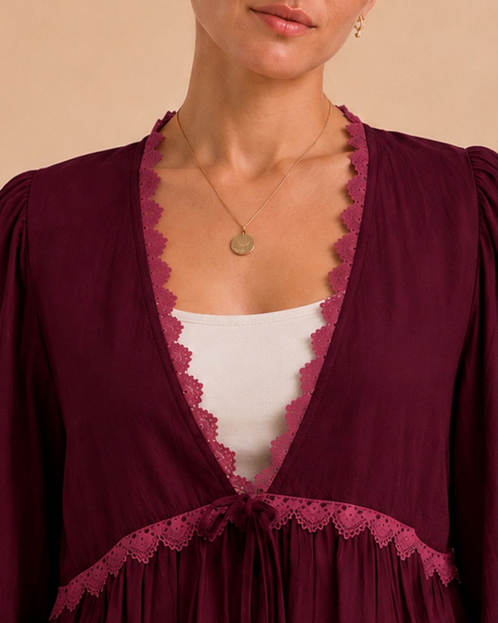 Burgundy blouse neckline and lace detail
