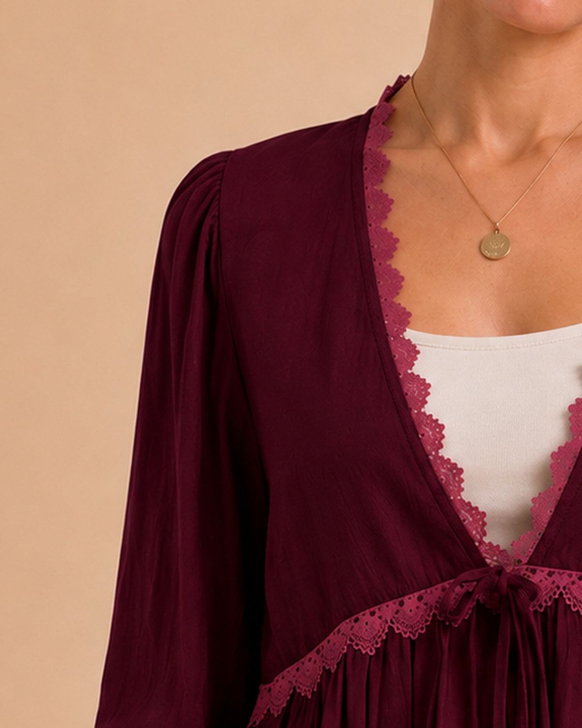 Burgundy blouse shoulder and sleeve shape detail