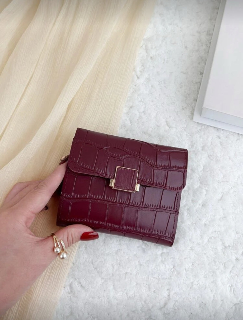 Burgundy crocodile texture compact wallet detail view