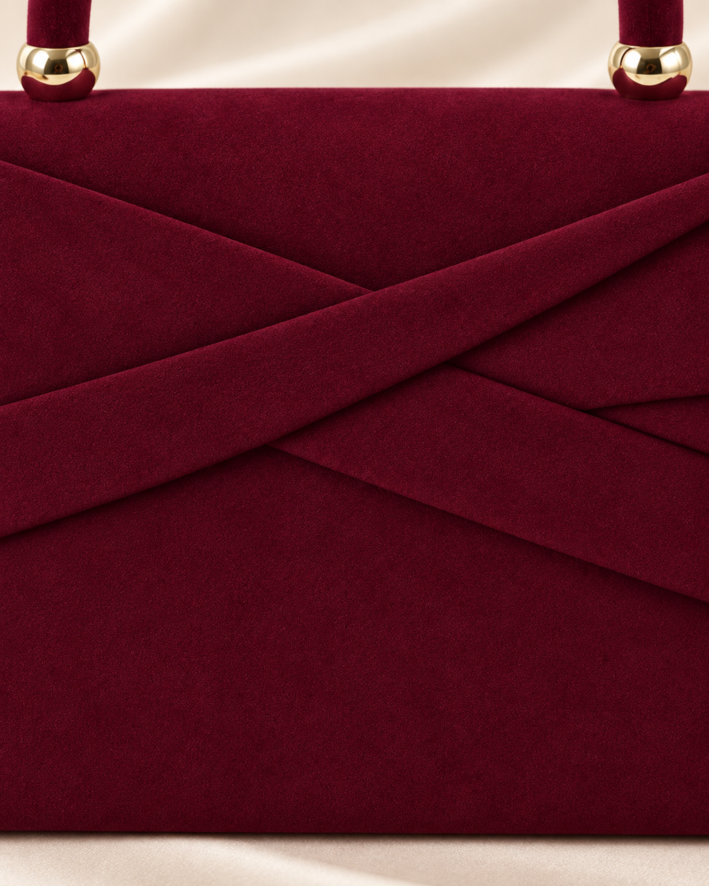 Burgundy handbag asymmetric front fold detail