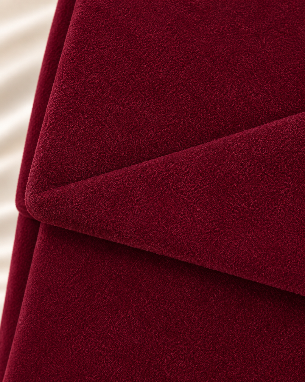 Burgundy handbag velvet texture detail