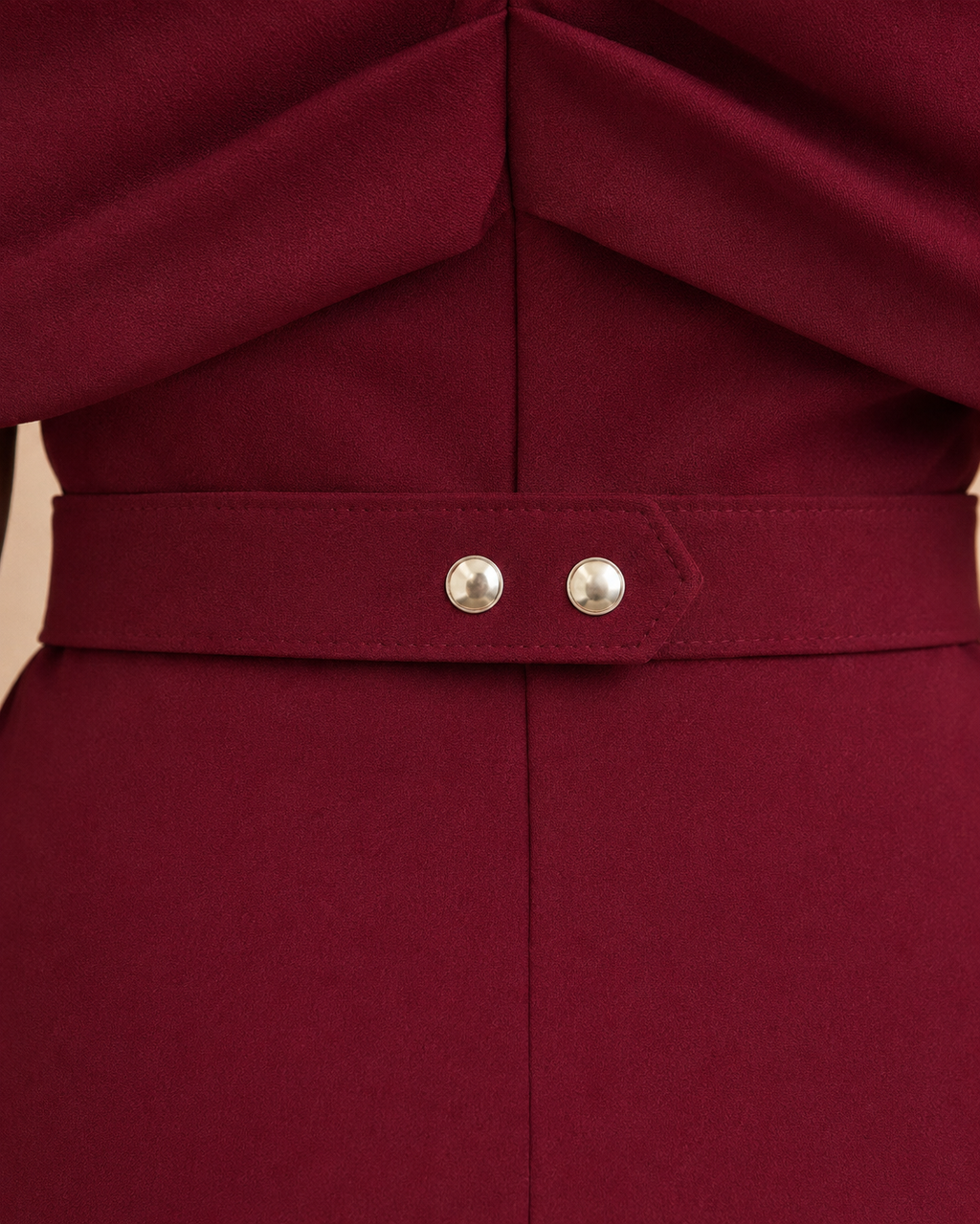 Burgundy jumpsuit back waistband with two silver buttons