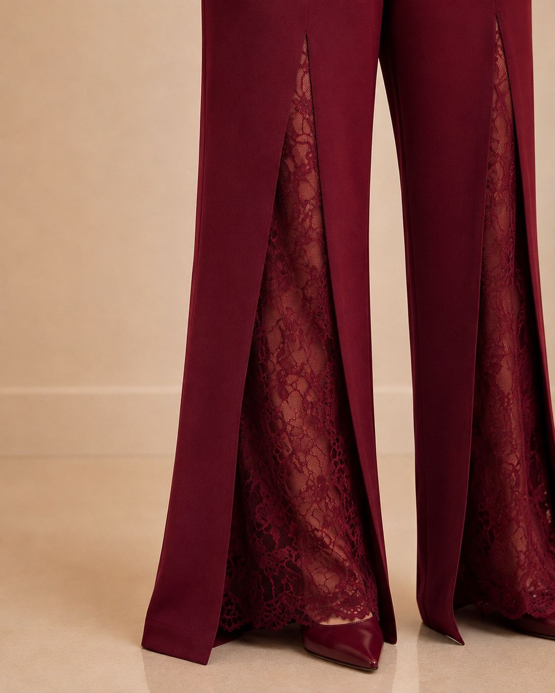 Burgundy jumpsuit trouser leg lace panel and hem detail