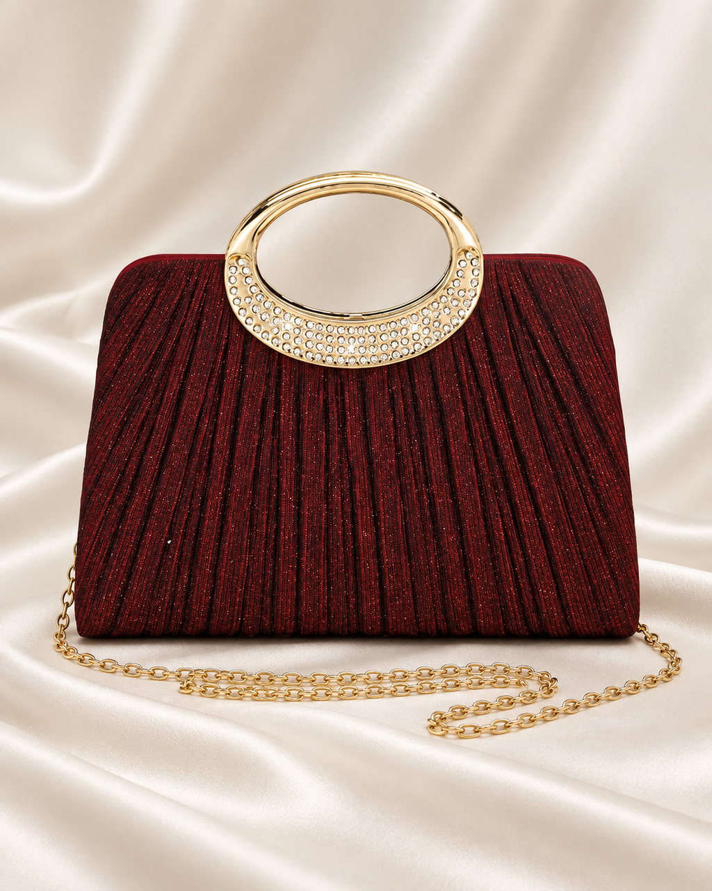 Burgundy pleated evening bag with gold rhinestone handle