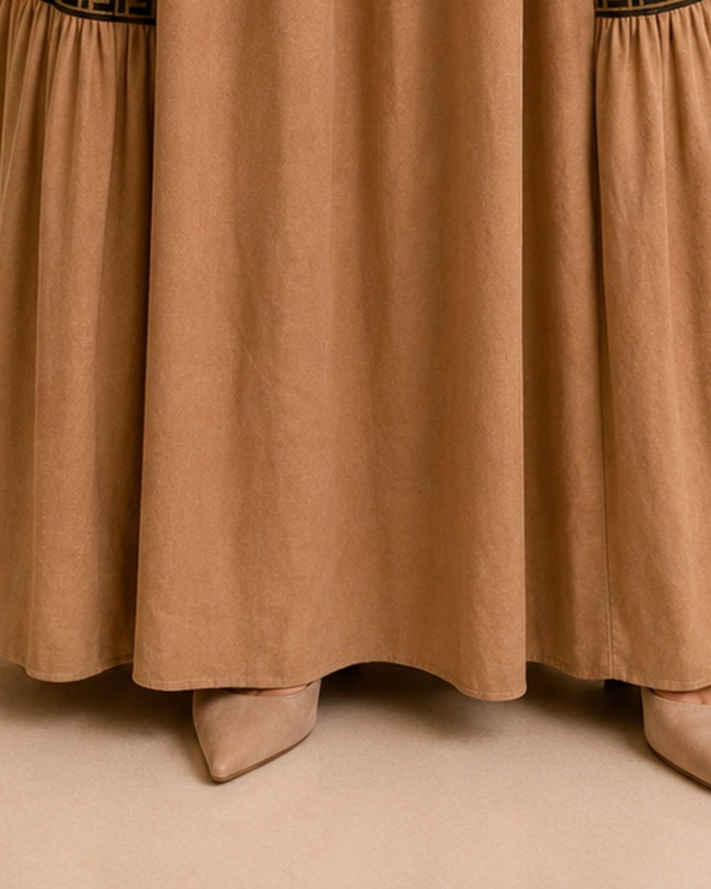 Camel maxi skirt hemline detail