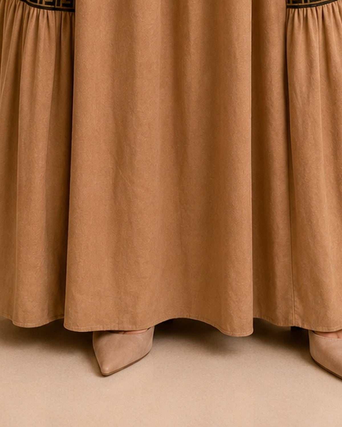 Camel maxi skirt hemline detail