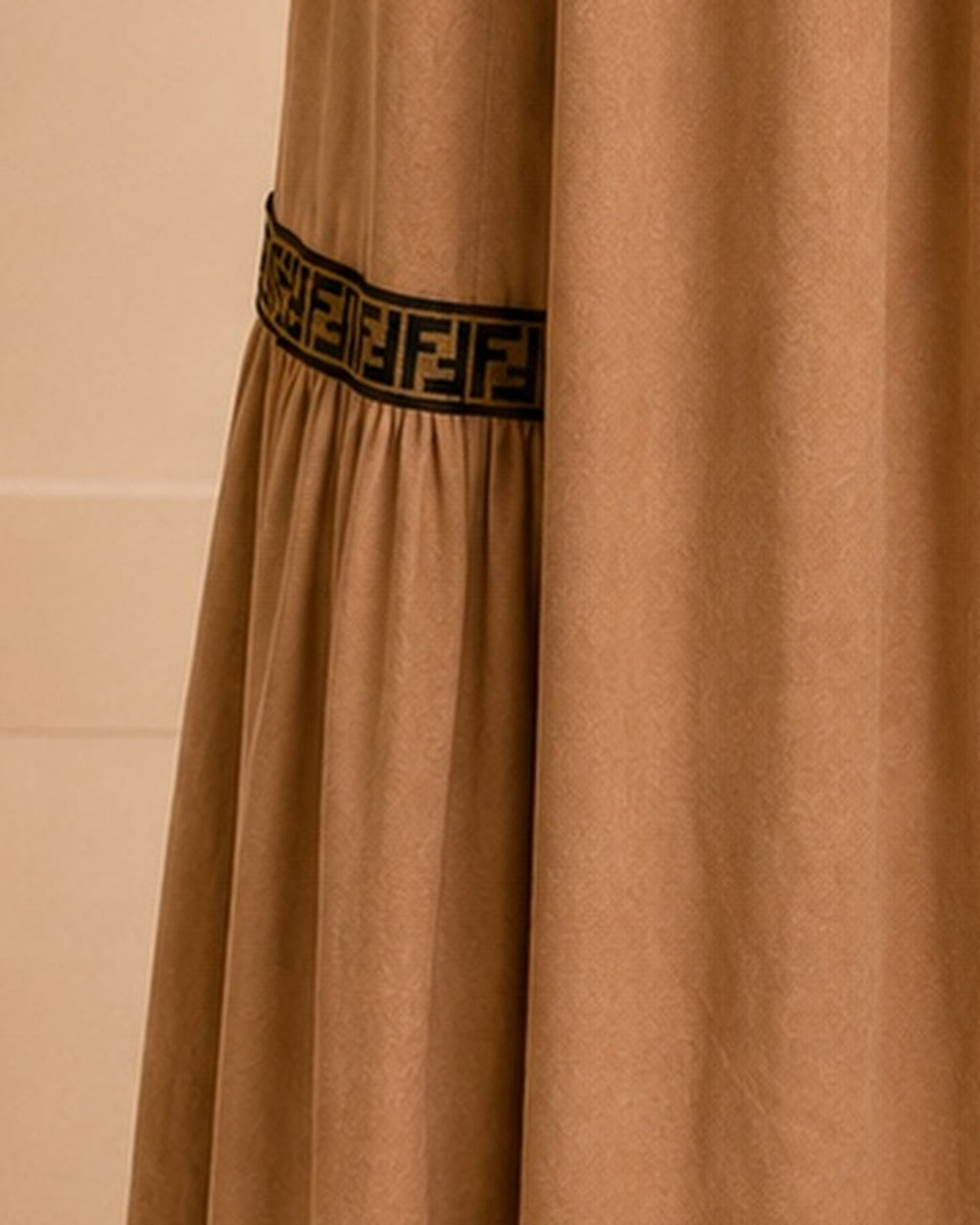 Camel maxi skirt lower geometric trim detail