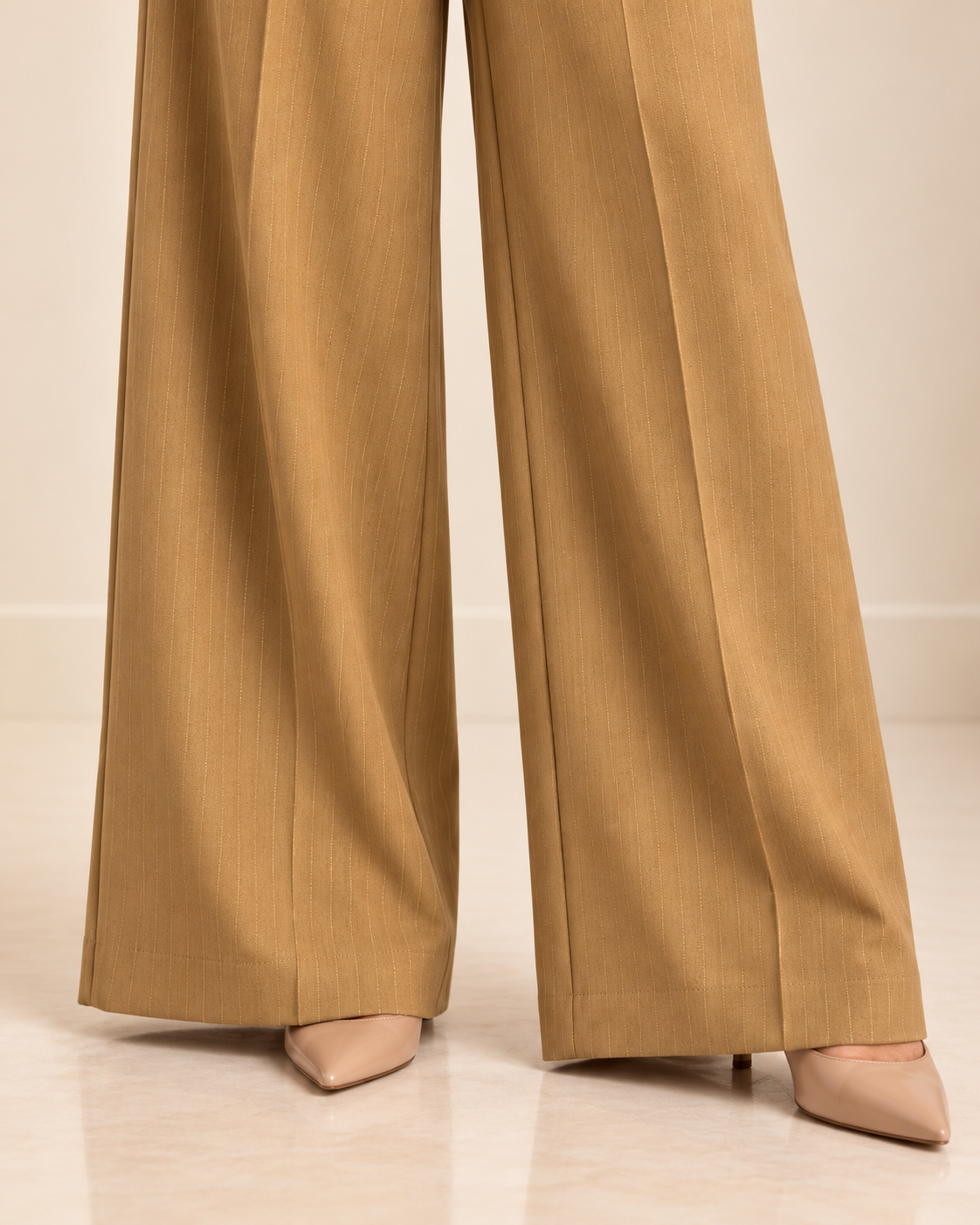 Camel pinstripe trousers wide-leg hem detail