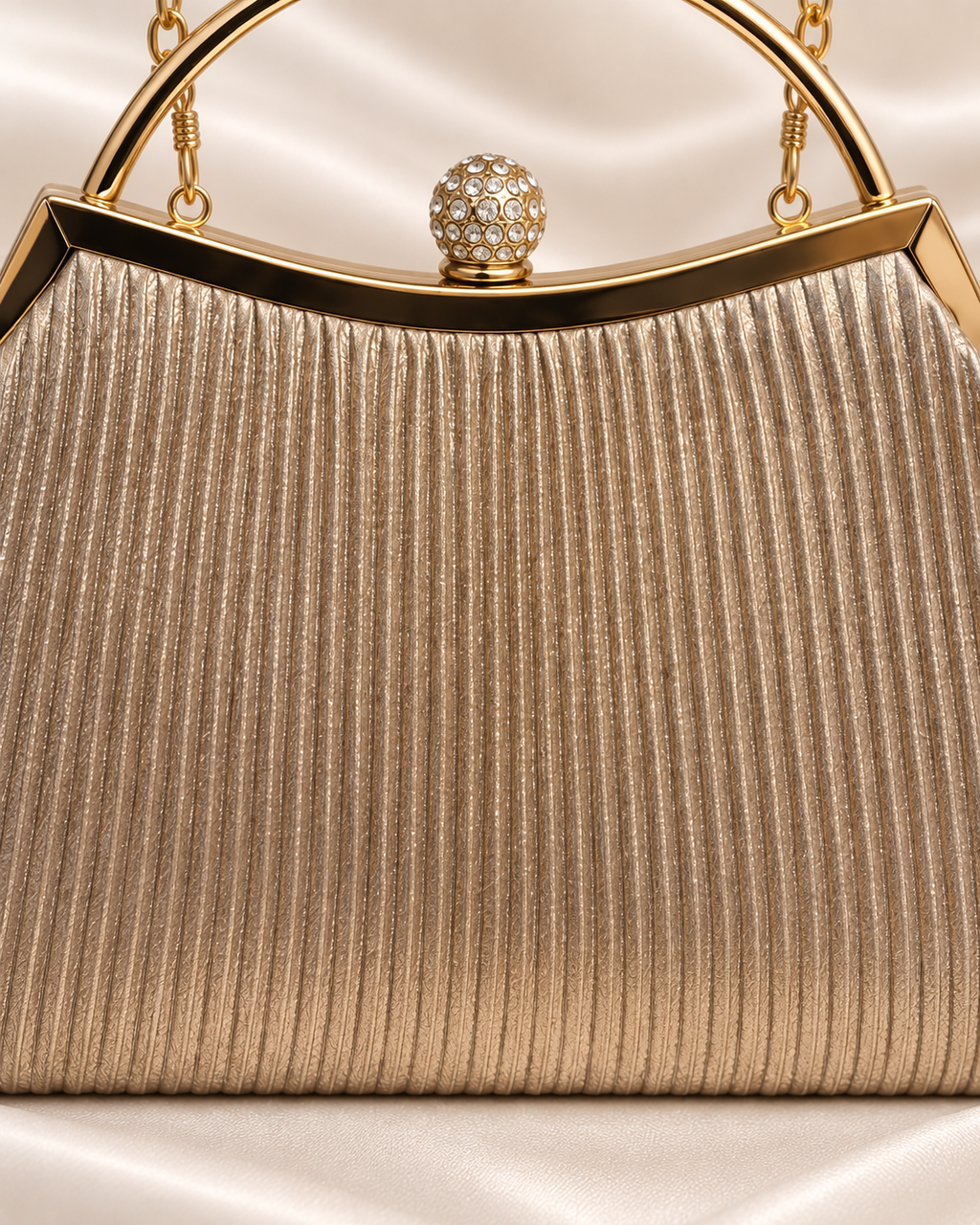 Close-up of champagne pleated texture and crystal clasp