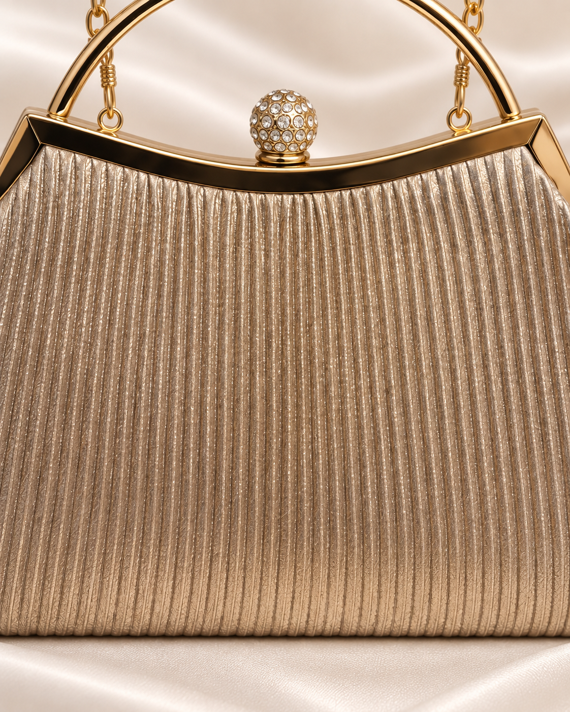 Close-up of champagne pleated texture and crystal clasp