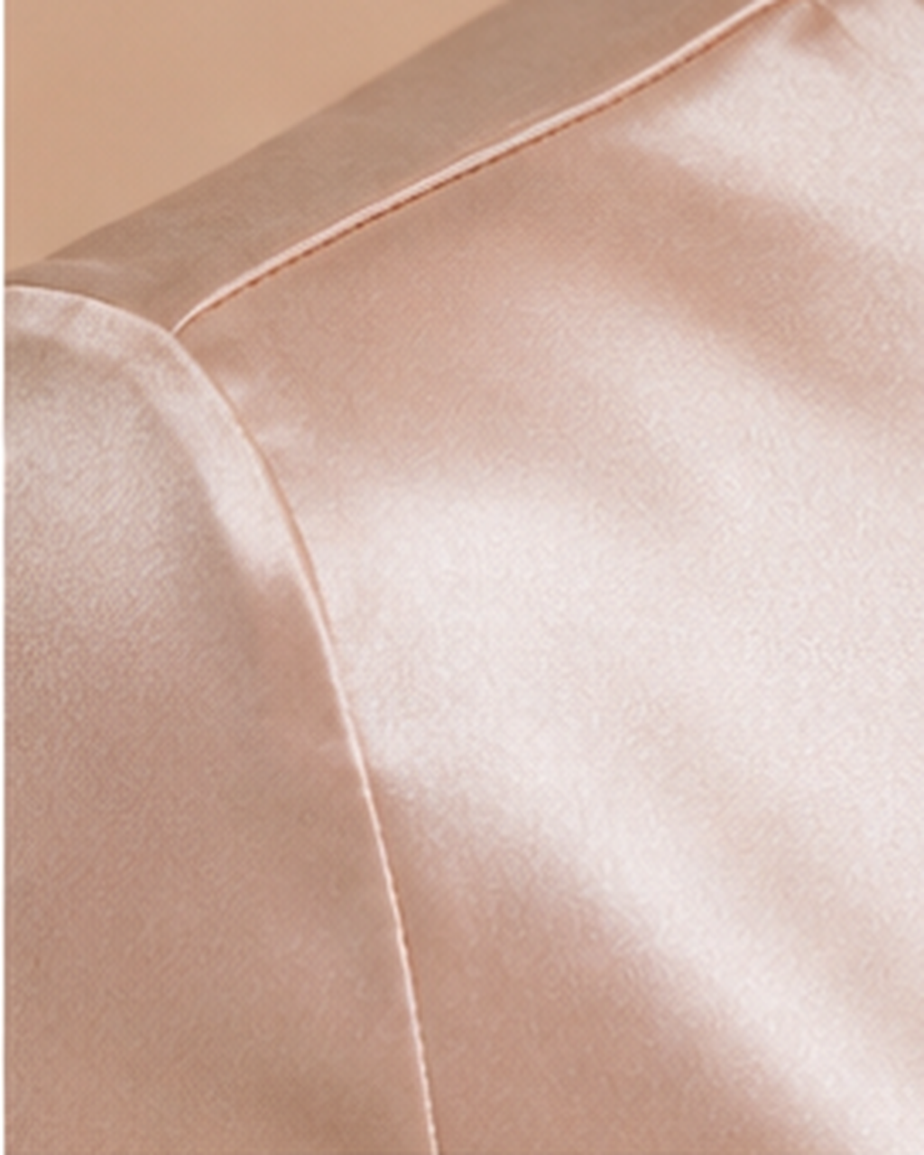 Champagne satin bodysuit shoulder seam detail