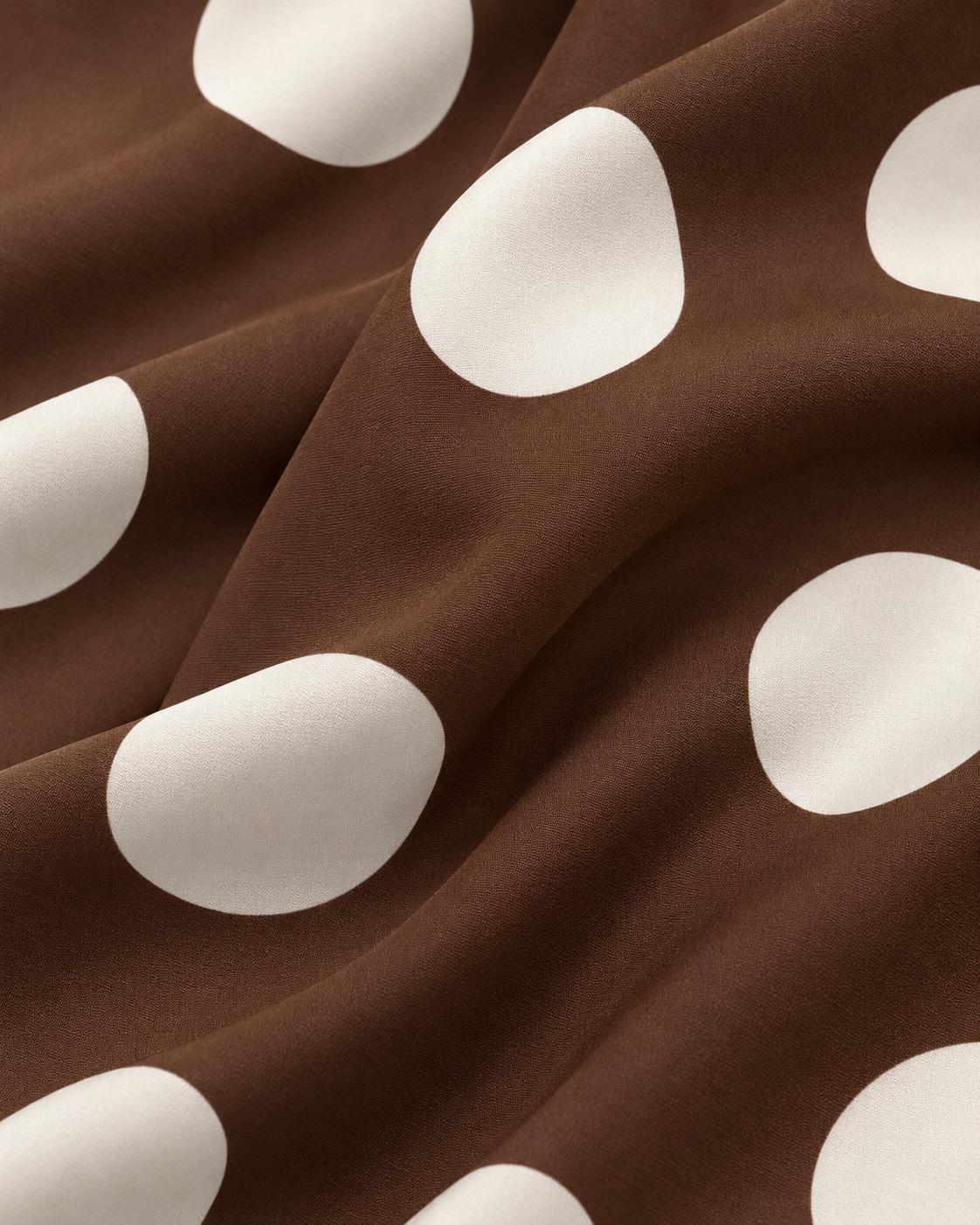 Brown polka dot trousers fabric texture detail