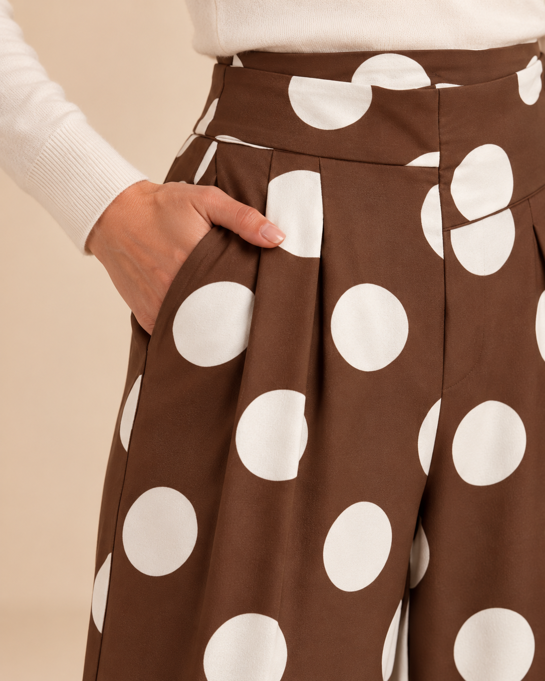 Brown polka dot trousers front pocket and pleat detail