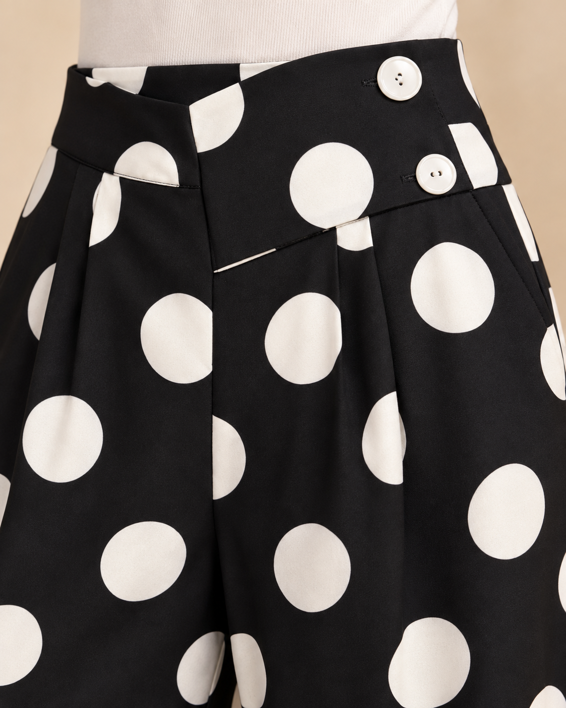 Polka dot pants button closure and pocket detail