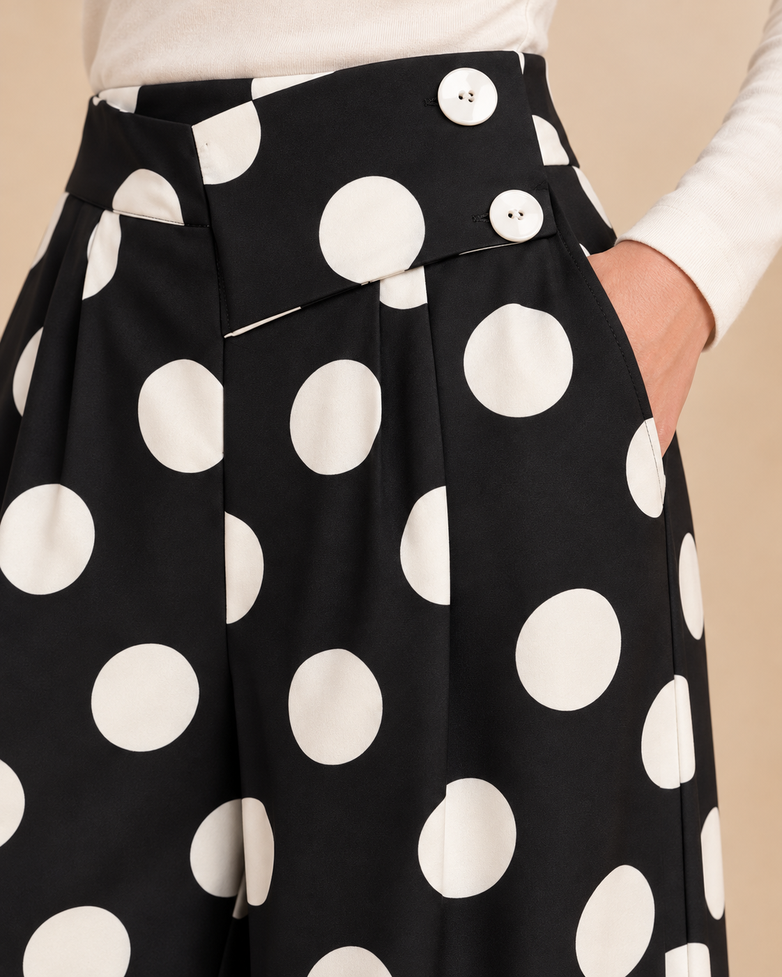 Polka dot pants waist closure close-up