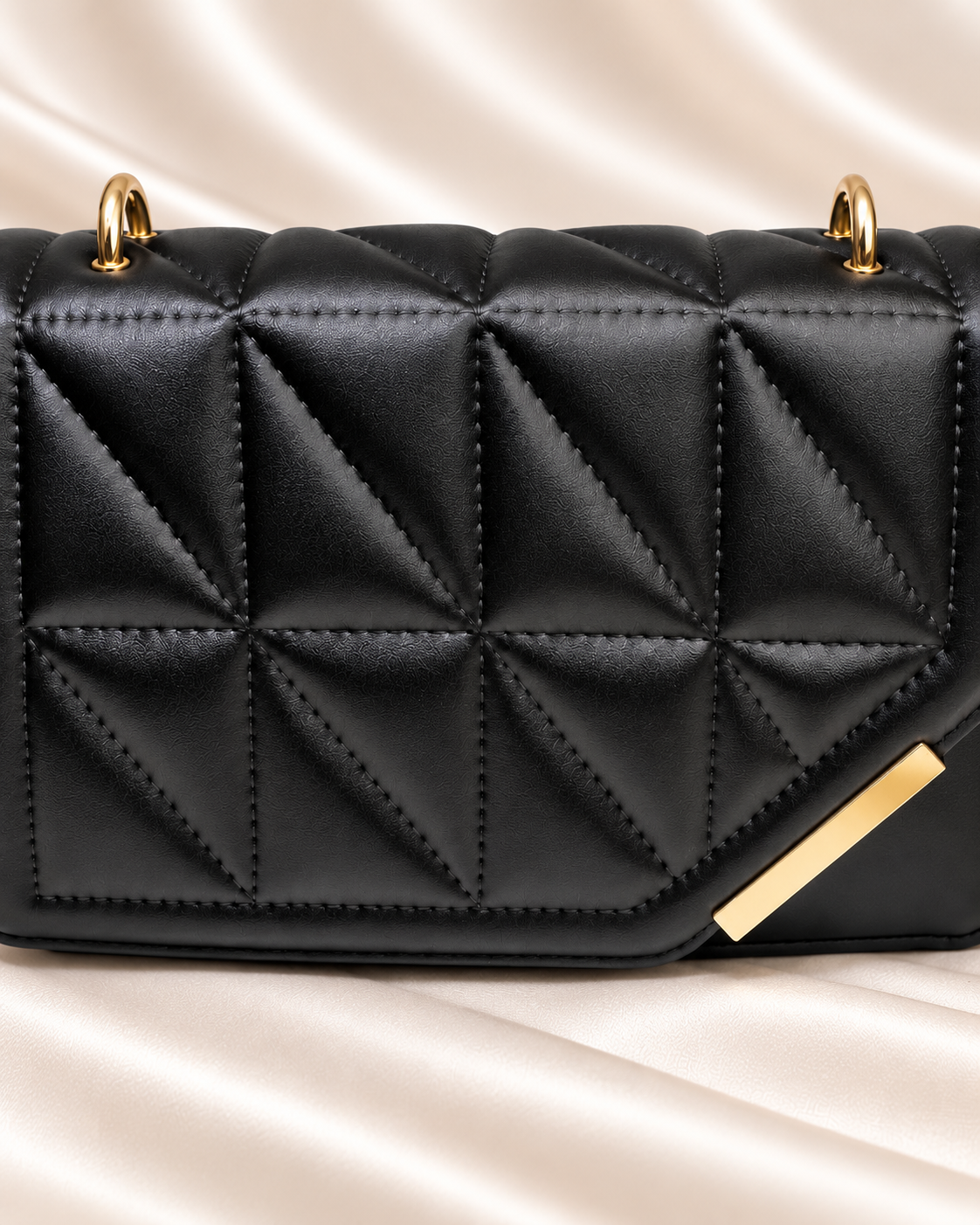 Black geometric quilted bag front quilting detail