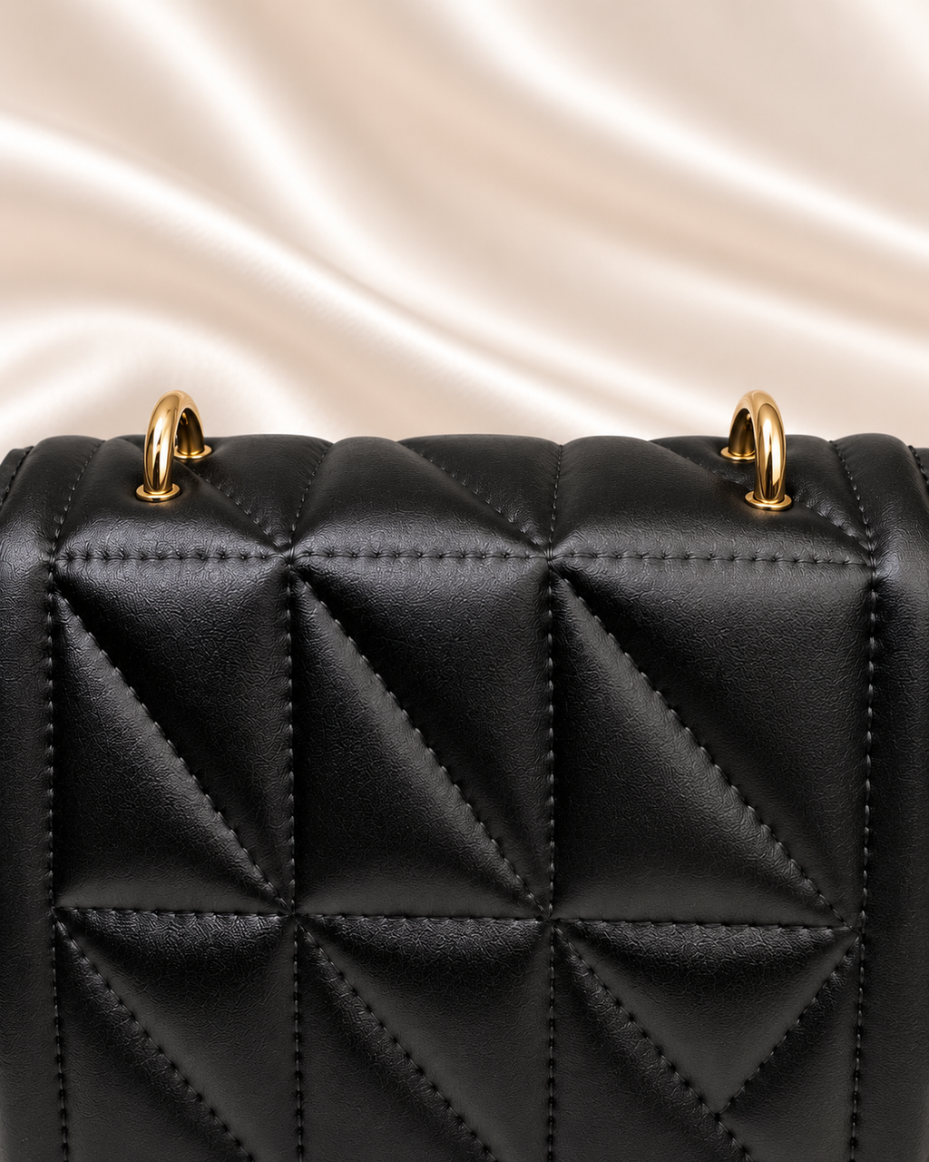 Gold attachment rings and upper quilting detail