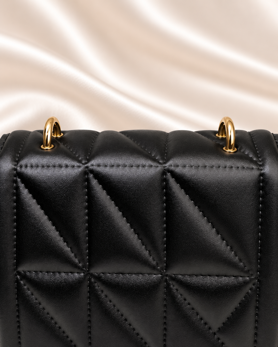 Gold attachment rings and upper quilting detail