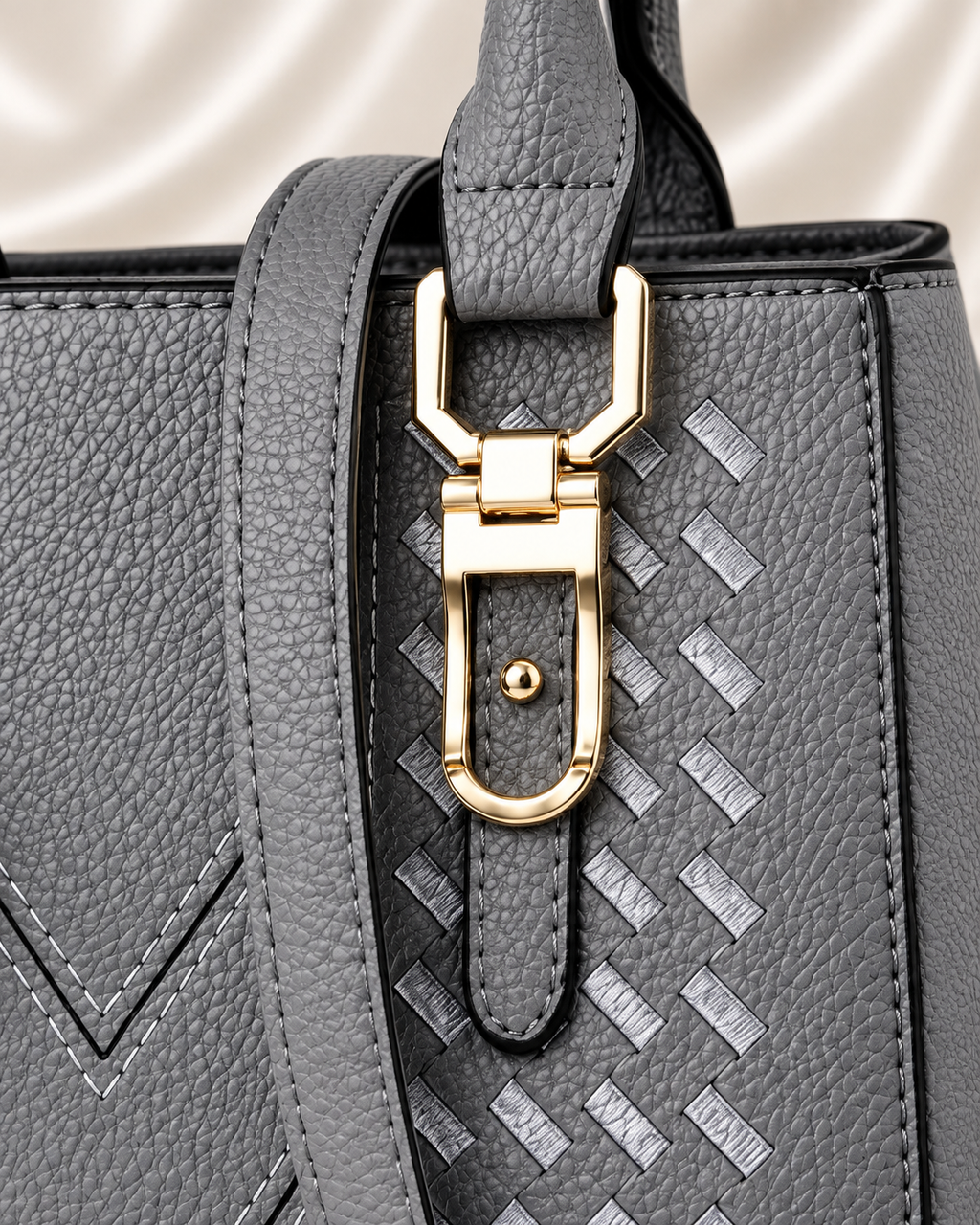 Gray handbag gold clasp detail