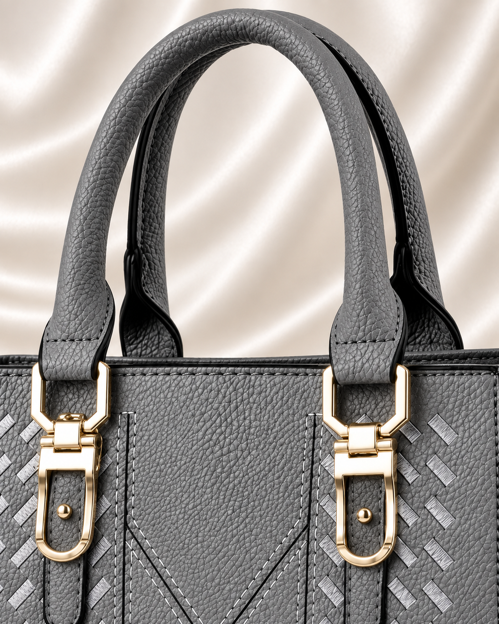 Gray handbag padded handles and gold hardware detail