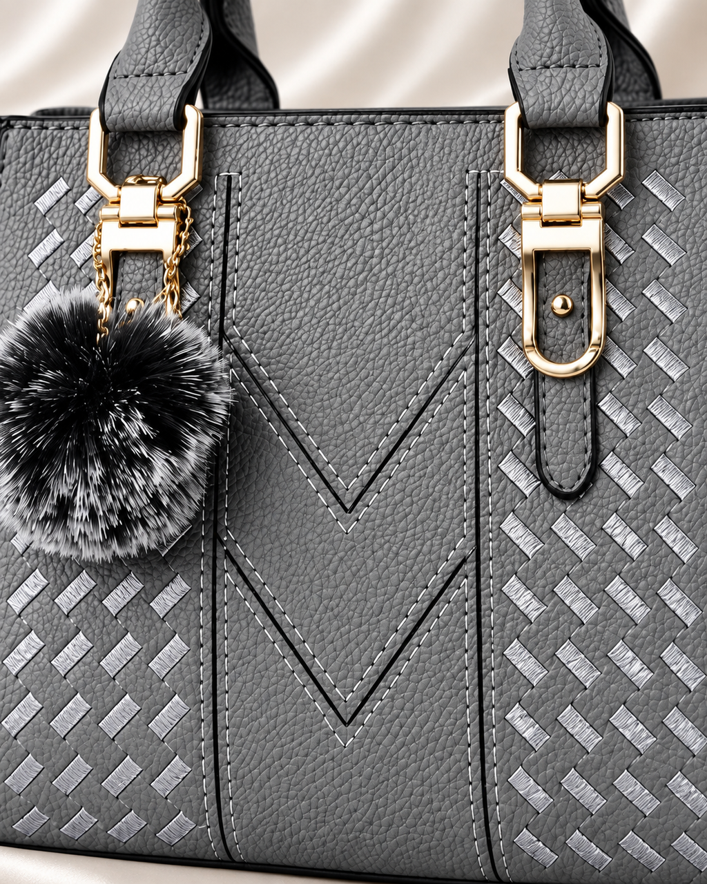 Gray handbag pebbled texture and V stitching detail