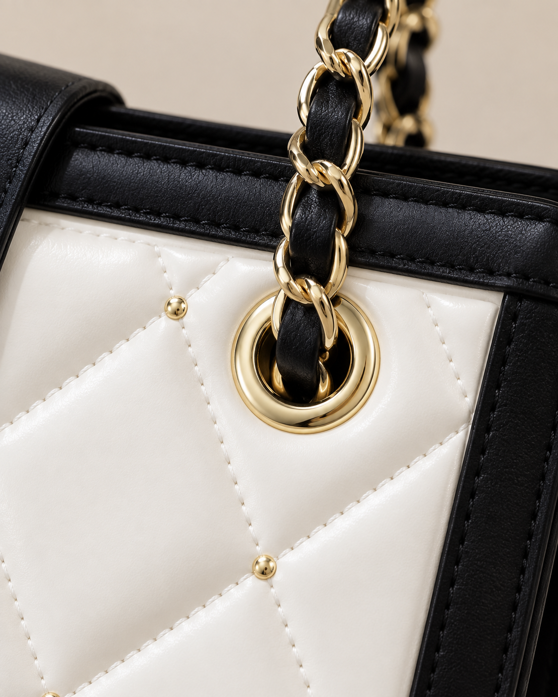 Gold eyelet and chain threading detail