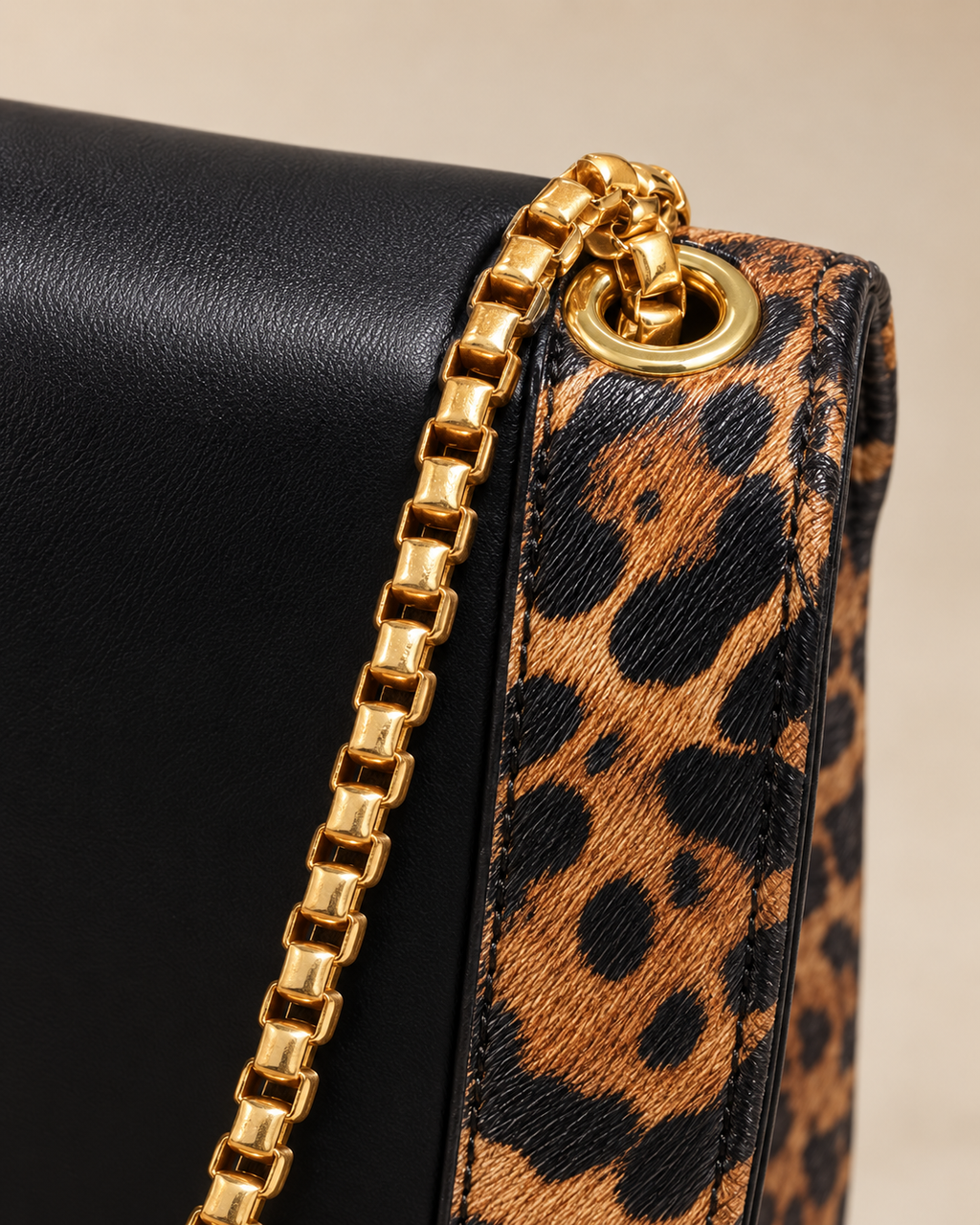 Gold chain and leopard trim detail