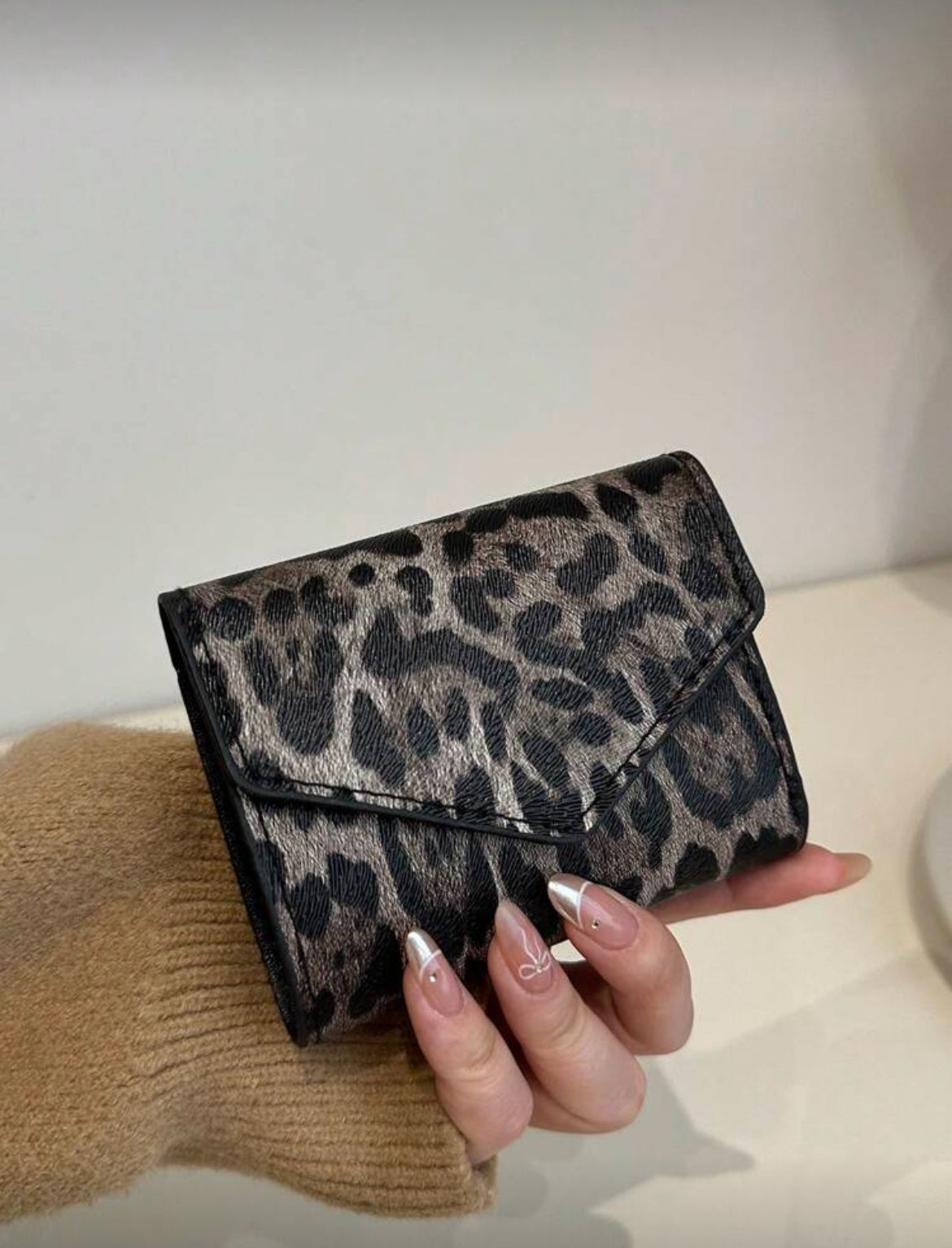Leopard Print Compact Wallet in hand