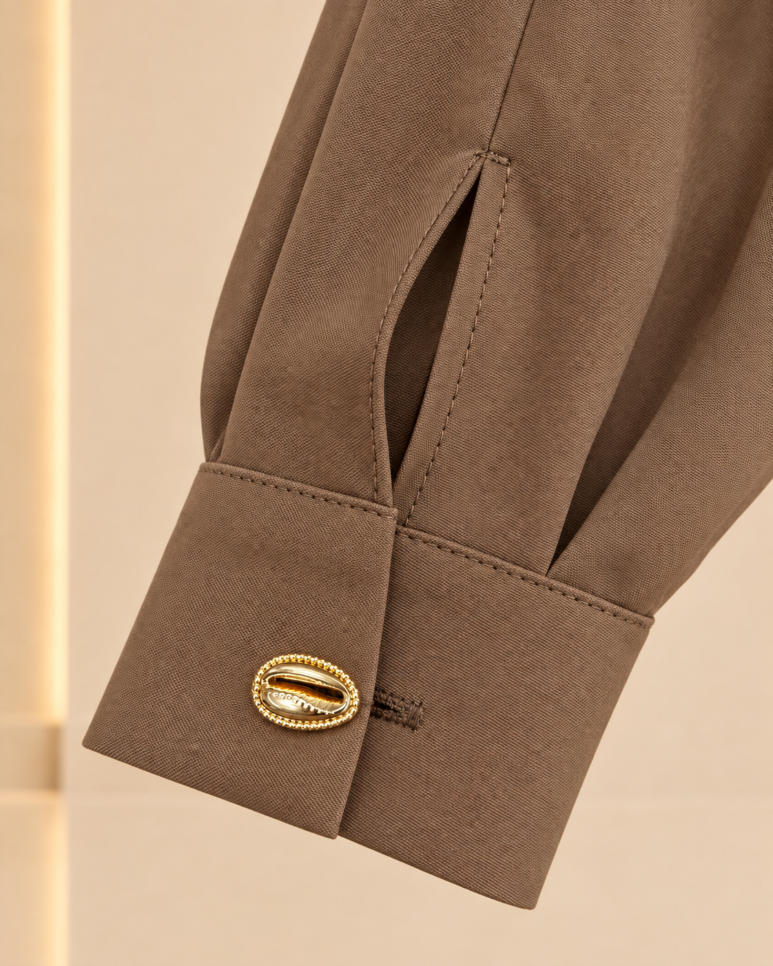 Cuff and gold button detail