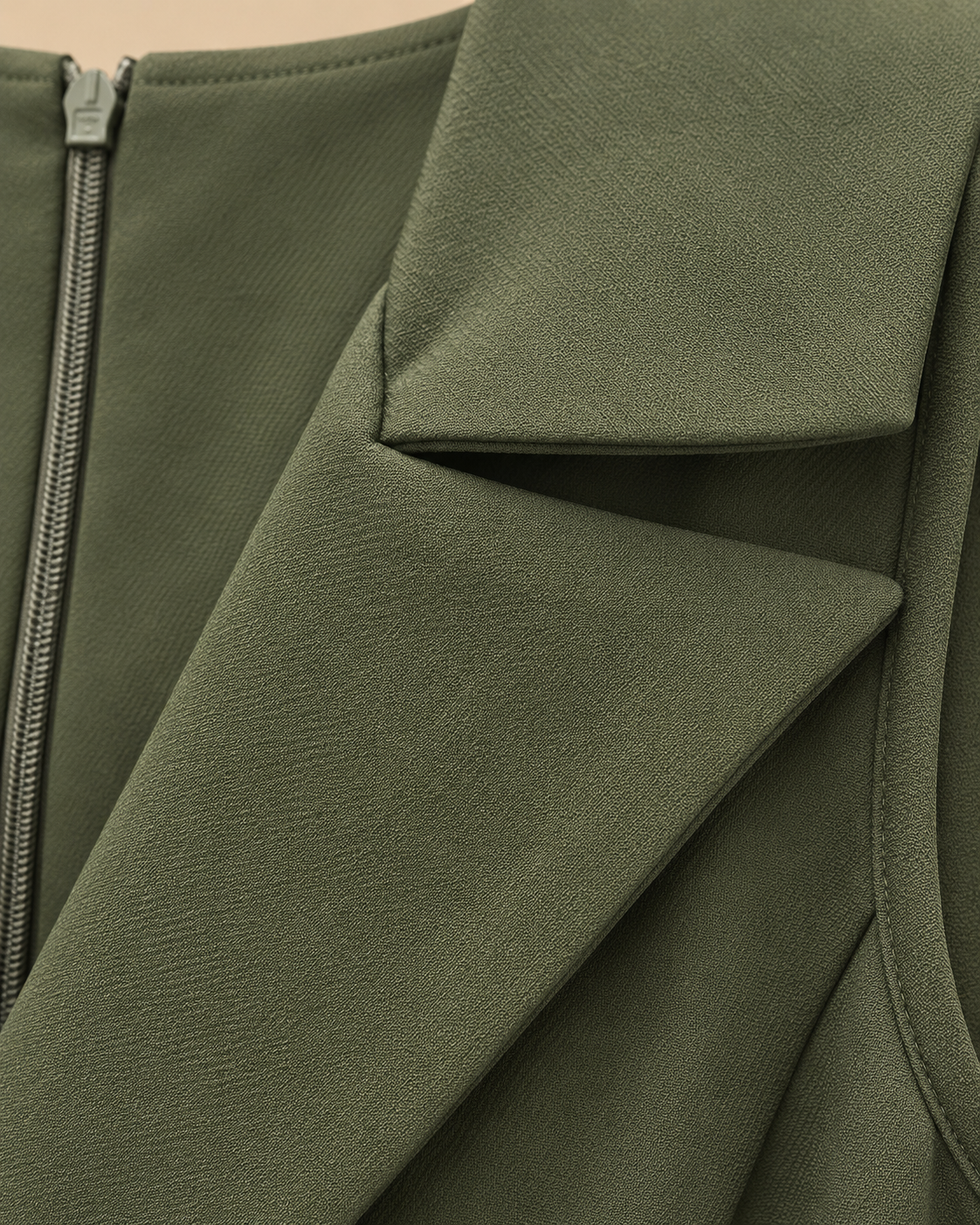 Olive green jumpsuit fabric texture and lapel detail
