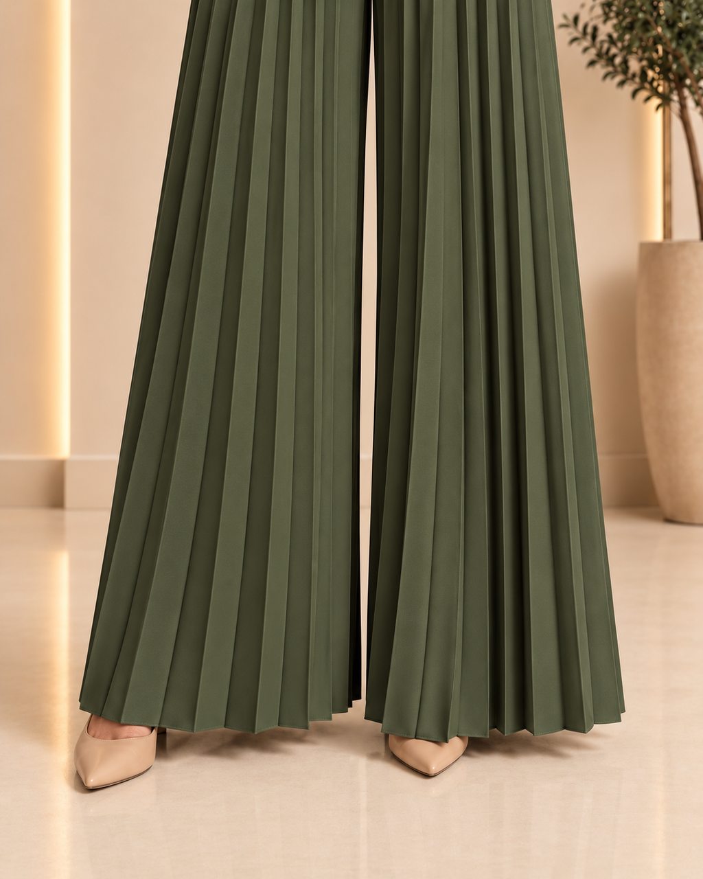 Olive green jumpsuit pleated hem and trouser leg detail