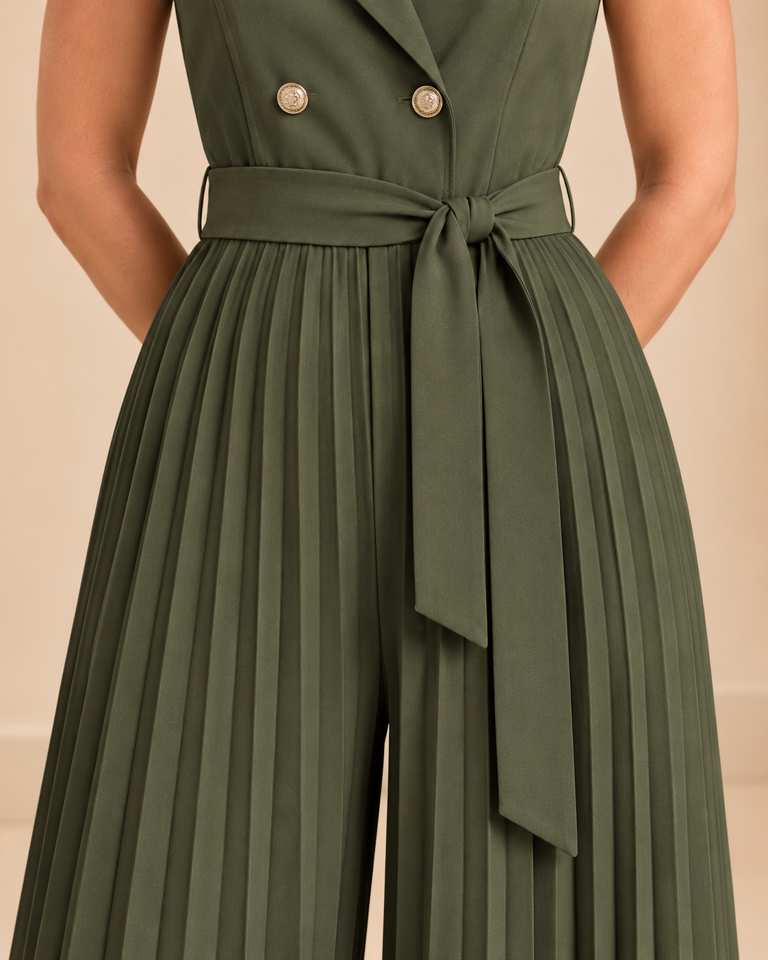 Olive green jumpsuit waist belt and pleat detail
